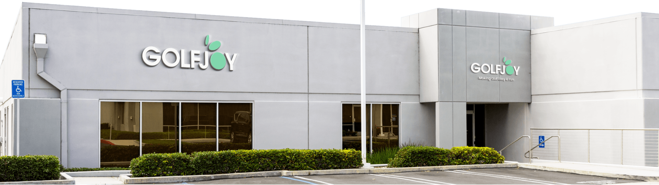 Golfley building exterior with logo on a clear night